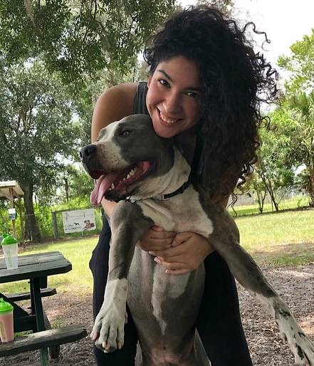 woman hugging dog